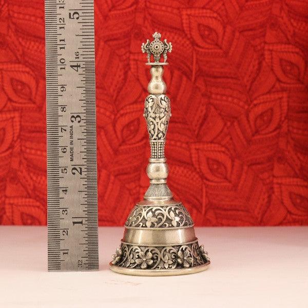 925 silver 3D Shanku Chakram bell idol weighing 121g and measuring 11.5cms in length against a red background and ruler.