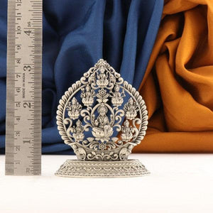 925 silver Ashtalakshmi idol, 8cm, 60g, purity 925, intricate design with measuring scale and colorful fabric background