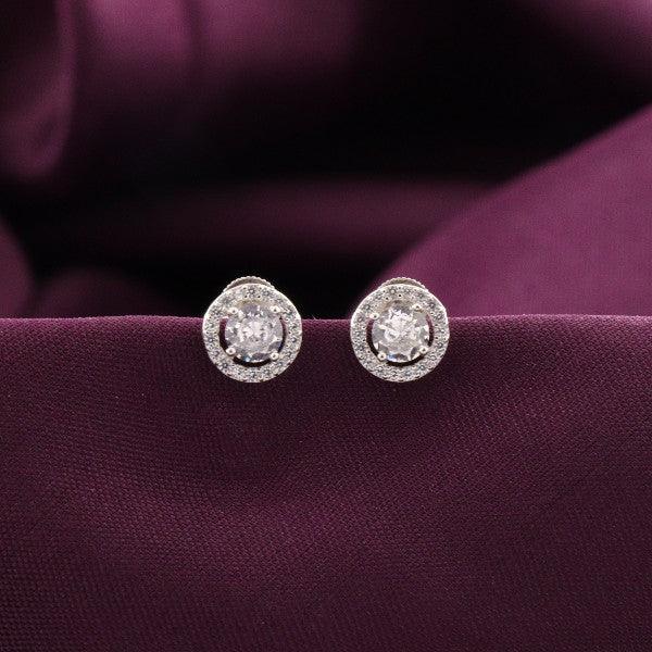 925 silver Sukthi women's studs STD-273 with sparkling stones, 2g weight, elegant design on purple background