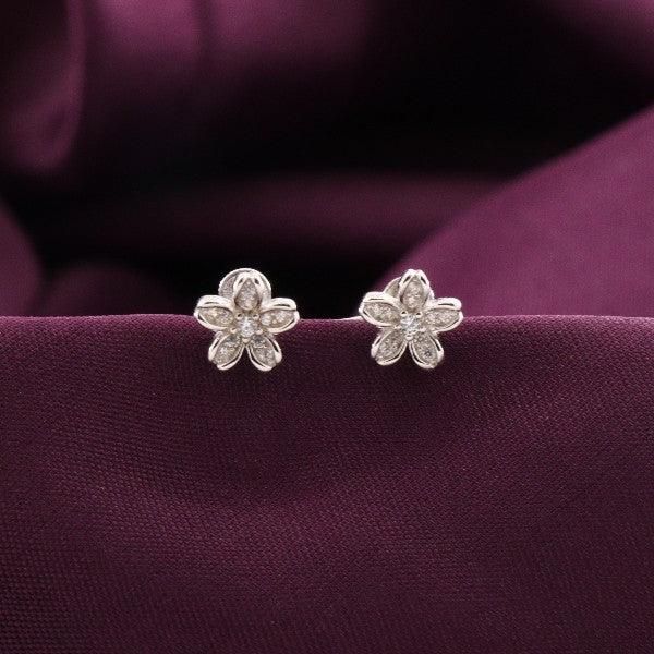 925 silver Quarrtulain kids flower-shaped studs KS-176, 2g purity, elegant design on purple fabric