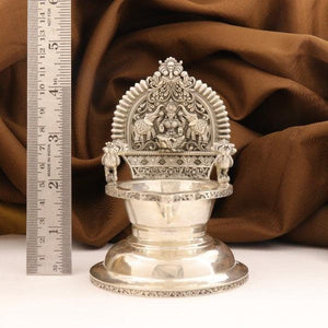 "925 Silver Kamakshi Articles Deepam AD-31 with 182g weight and intricate design, measured beside ruler"