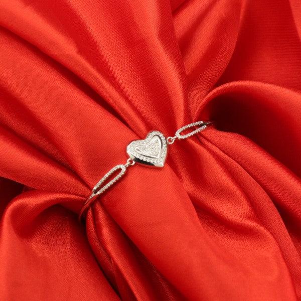 Elegant 925 silver heart kada for women, WKD-154, adjustable size, weighing 10g, displayed on vibrant red fabric.