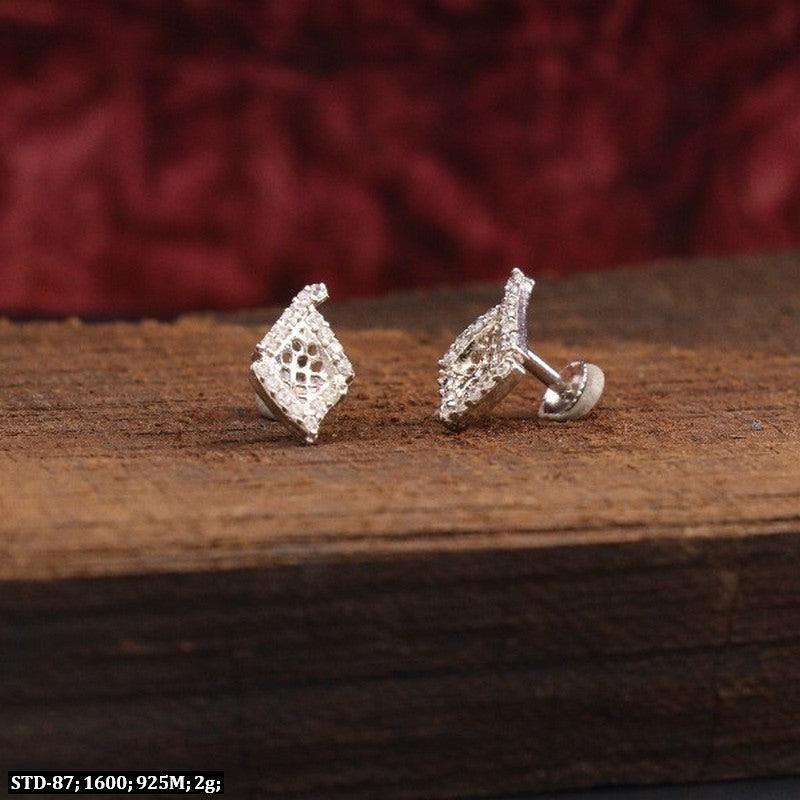 925 silver Wamil Women Studs STD-87, 2g, showcasing intricate design on a rustic wooden surface.