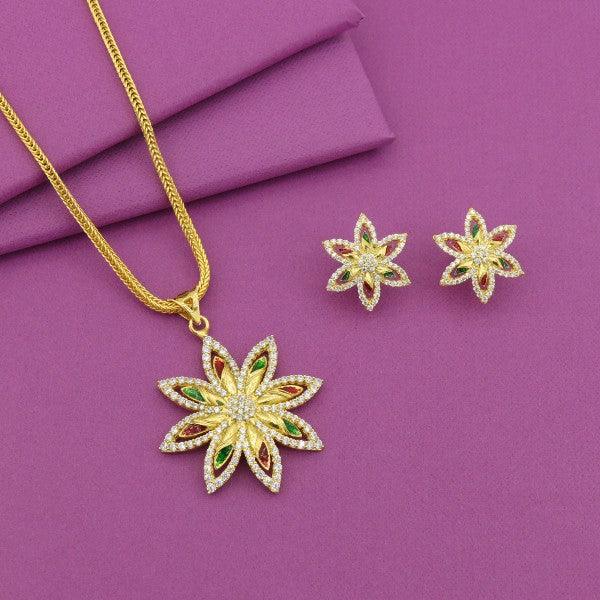 Gold flower necklace and earring set on a purple background