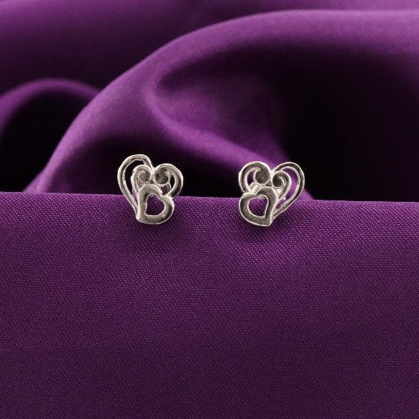 925 Silver Shrigauri Kids Studs KS-147, heart design, on a purple fabric background.