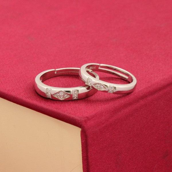 925 silver Rupa couple rings CR-32 on red background, 5g adjustable size rings with diamond-like accents, elegant and pure 925 silver jewelry.