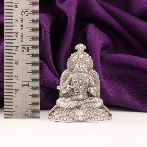 925 silver Annapurna Devi idol, 35g, 5cm height, purity 925, next to a measurement ruler with purple fabric background