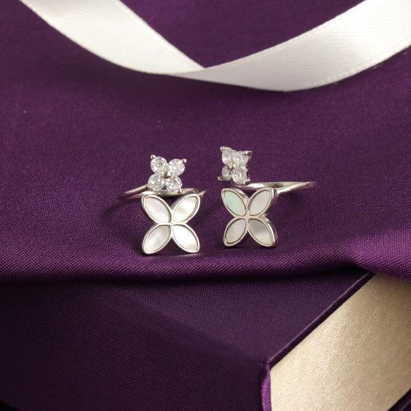 925 silver flower toe rings for women with 5g weight and butterfly design on a purple fabric background