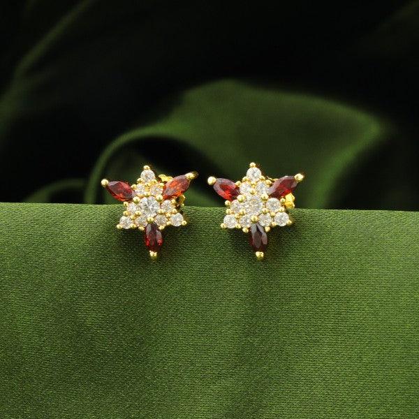 925 silver flower women studs STD-189 with red and white gemstones on a green fabric background, 4g, 925 purity.