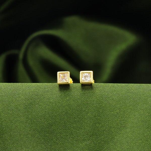 925 silver Komala kids studs KS-108 with golden square design on an elegant green fabric background