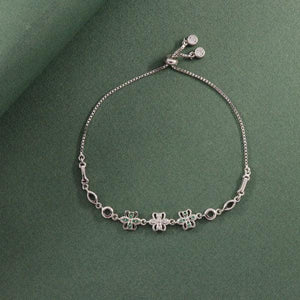 925 Silver Sarika Adjustable Women Bracelet LBR-336 featuring elegant charms on a green background