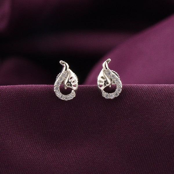 925 silver Januja women studs STD-281 with intricate design on purple fabric background, weighs 2g, purity 925