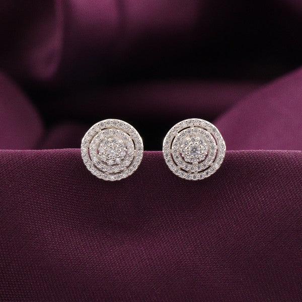 Elegant 925 silver Hasita women studs STD-271 with intricate design, 3g weight, displayed on deep purple fabric.