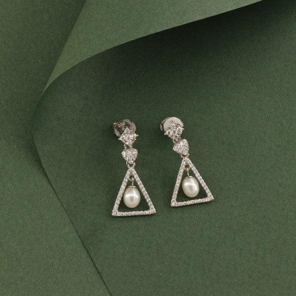 925 silver triangle dangler earrings for women with pearls on a green background