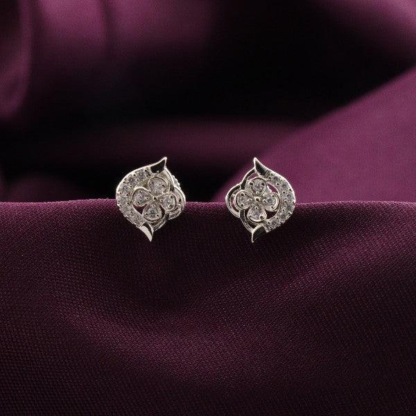 925 silver Poushali women studs STD-270, 2g weight, elegant design on dark purple fabric background