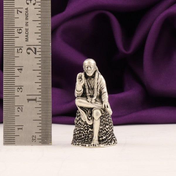 925 Silver 3D Sai Baba Idol, 4.5cm, 43g, with Ruler for Scale on Purple Background