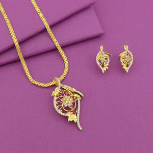 Elegant gold necklace with a matching pair of earrings featuring intricate floral designs, displayed on a purple background.