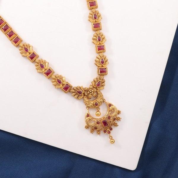 Elegant Preyasi women necklace with intricate gold and red gemstone details on a white and blue background