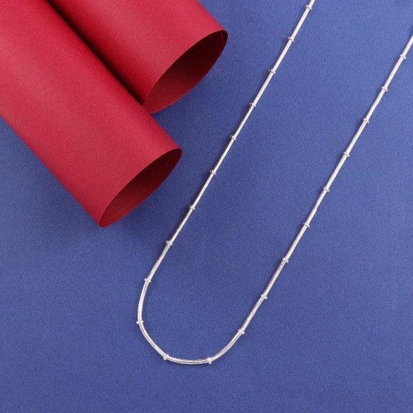 925 silver Damayanti women's chain LC-201, 51cm long, with 9g weight and 925 purity, displayed against a blue background with red cylindrical props.